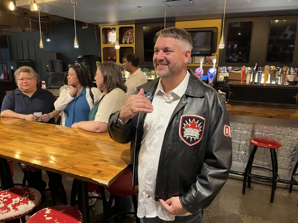 Engineering Class of 2000 alumni poses with their iron ring