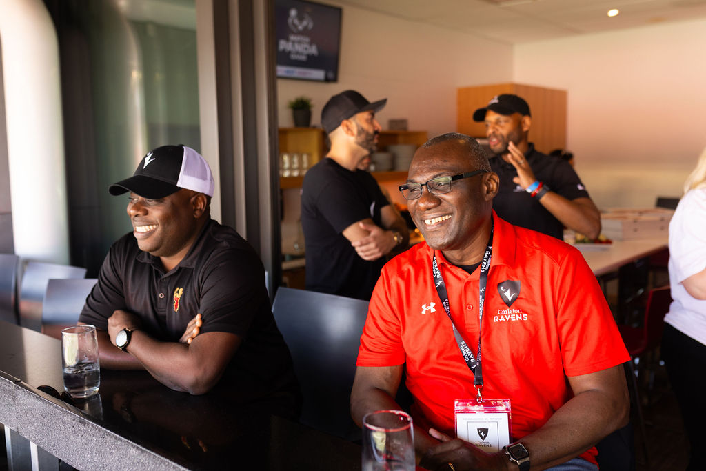 President and Vice-Chancellor Wisdom Tettey smiles while watching the Panda Game