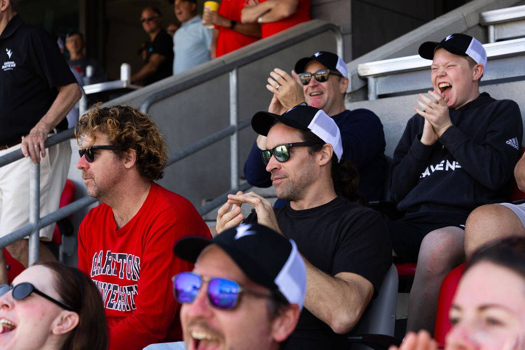 People cheering at the Panda Game
