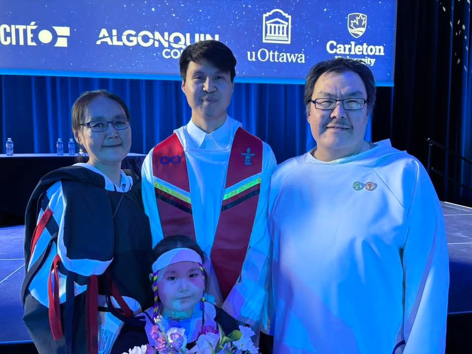 Brendan Mannik with his parents and younger sister