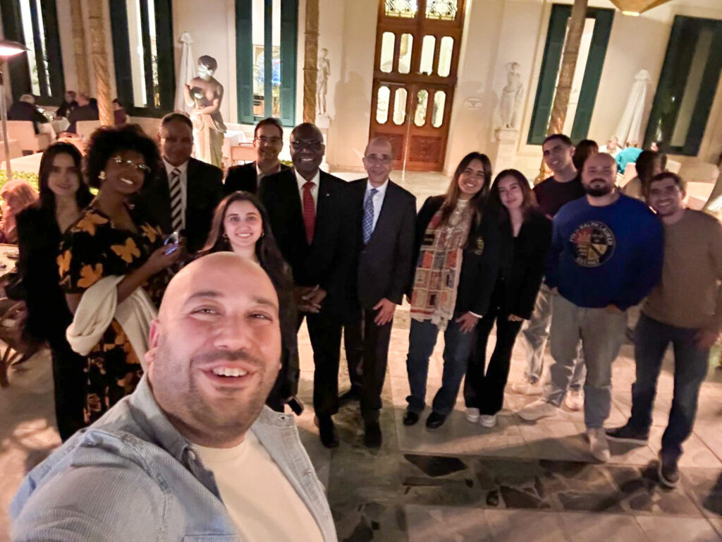 A group selfie of attendees at the Carleton University reception in Cairo, Egypt.