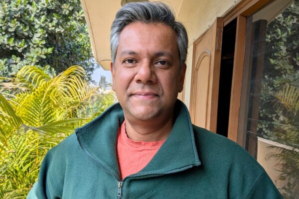 Vishnu Som wearing an official Residence Fellow sweater