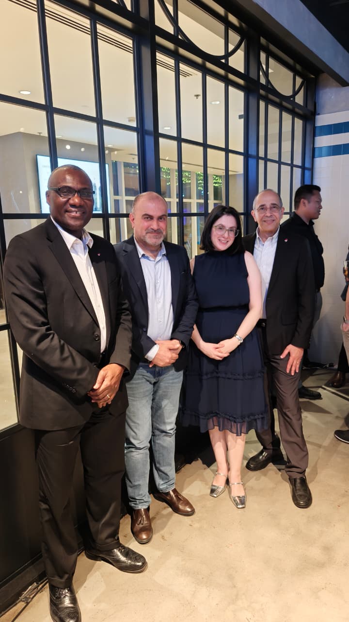 Photo of President Wisdom Tettey with two members of the UAE Dubai Chapter, and Rafik Goubran at an event in October 2025.
