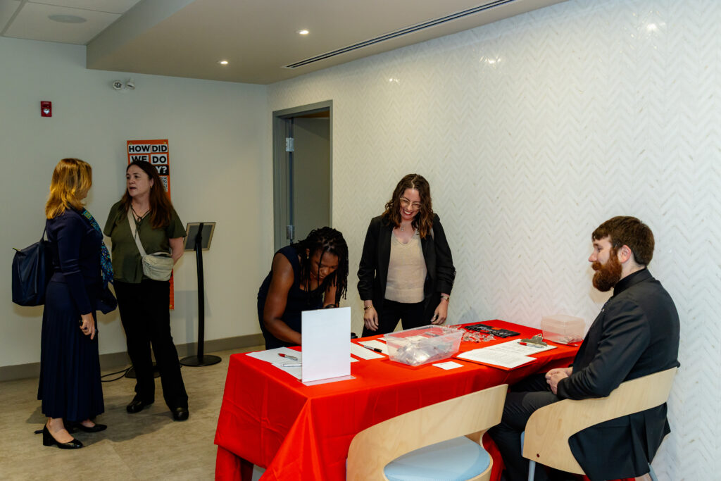 Attendees arrive and check in at the Philanthropy and Nonprofit Leadership Alumni Chapter launch event.