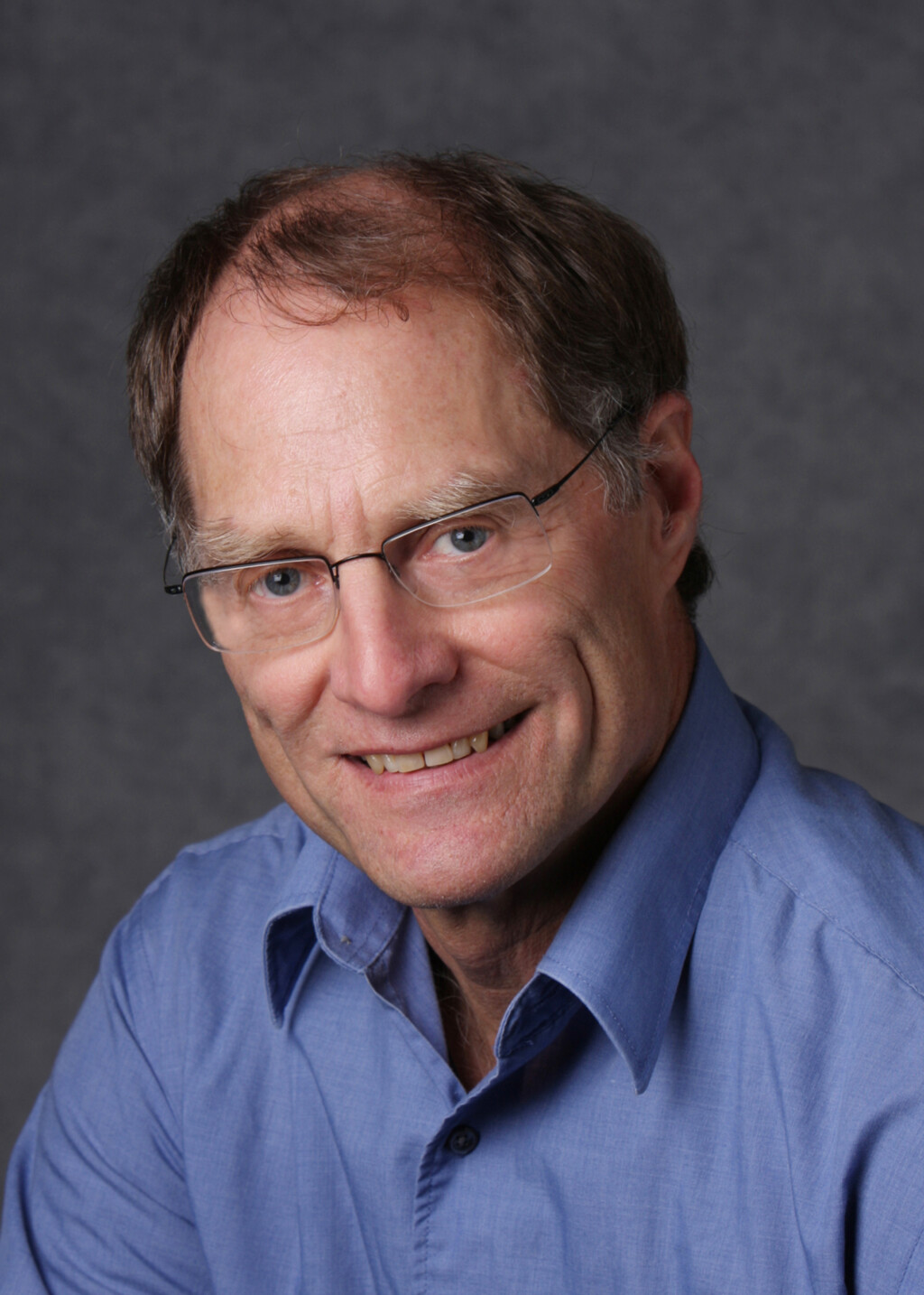 headshot photo of retired Sprott professor, Darrell Herauf