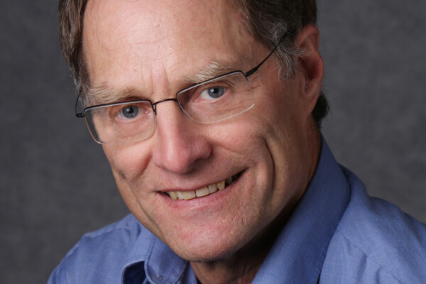 headshot photo of retired Sprott professor, Darrell Herauf