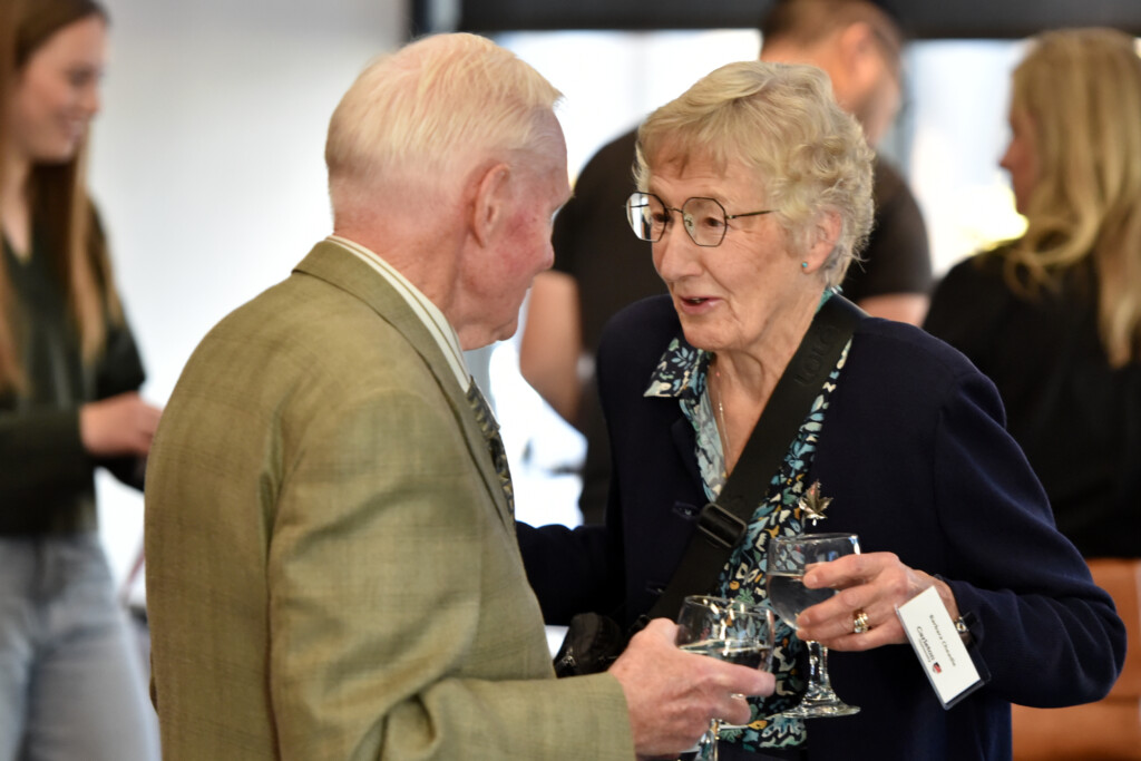 a photo of two people talking. 
