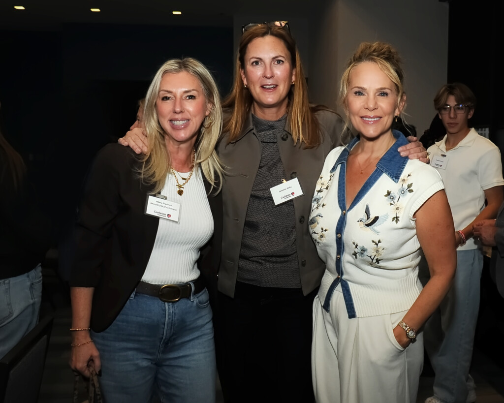 a photo of three women smiling.