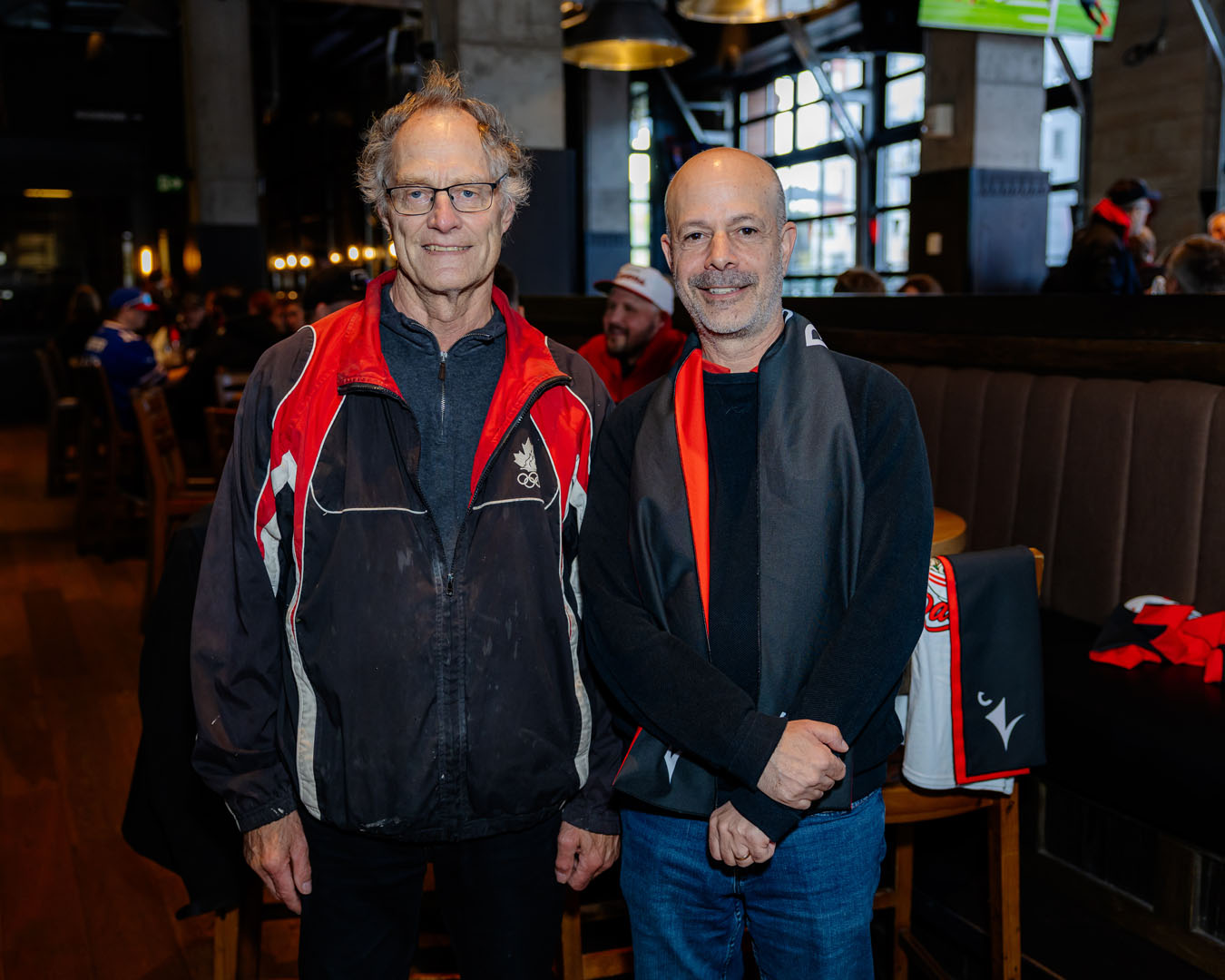 Two people smile for a photo at the Pancaker breakfast