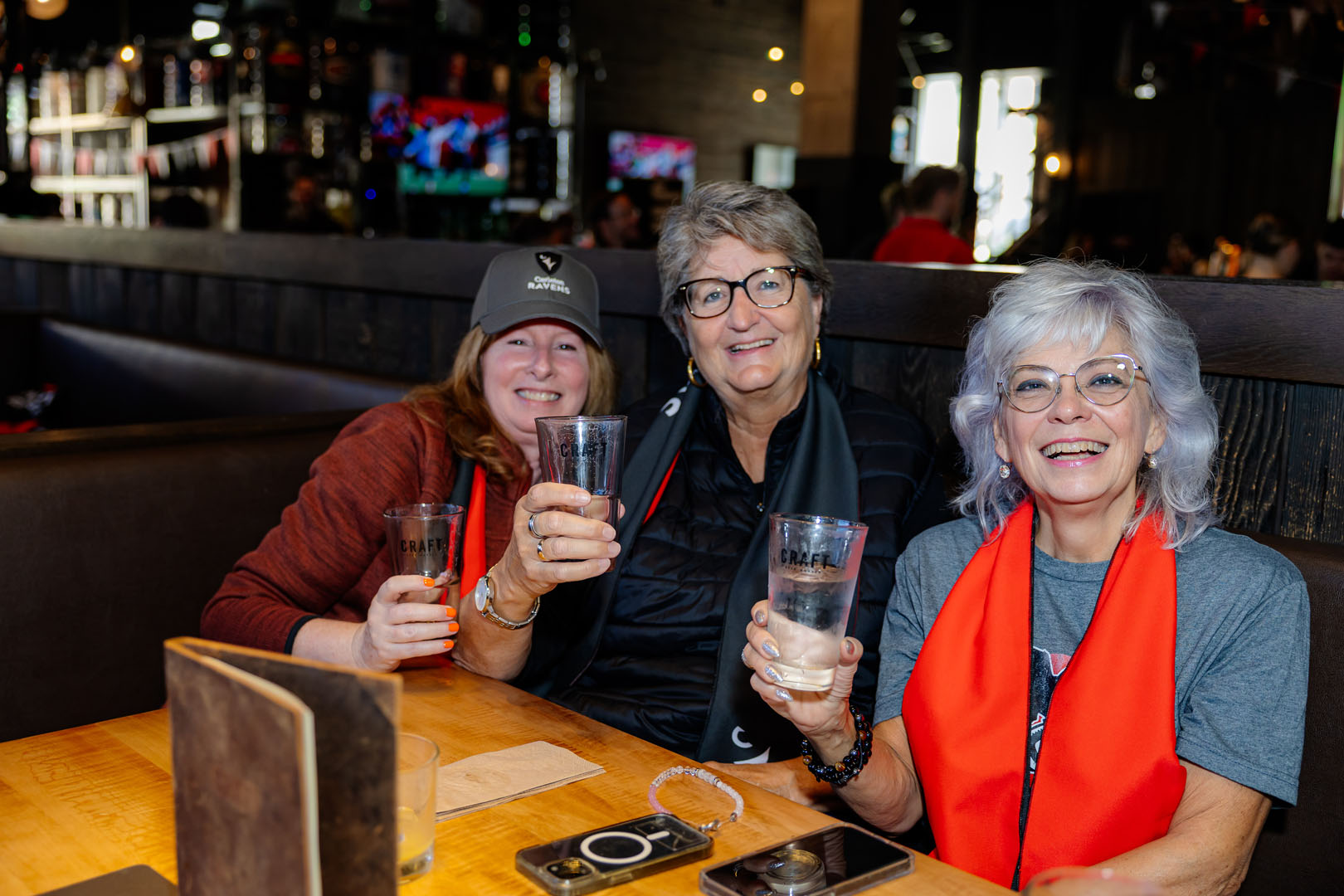 Three people smiling at the Pancaker breakfast