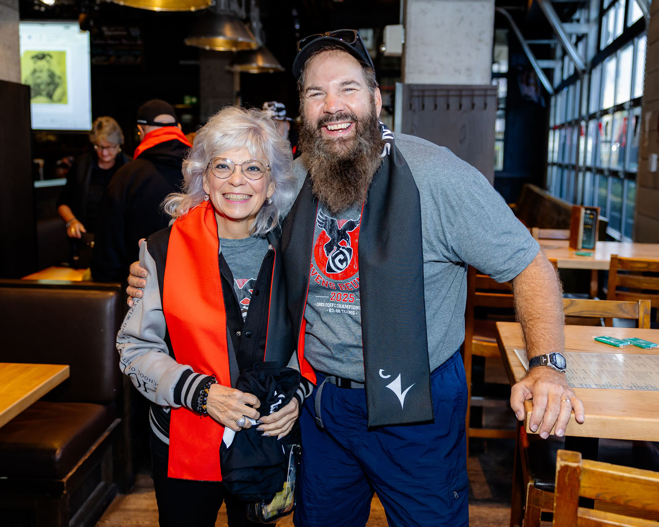 Two people smile at the Pancaker Breakfast