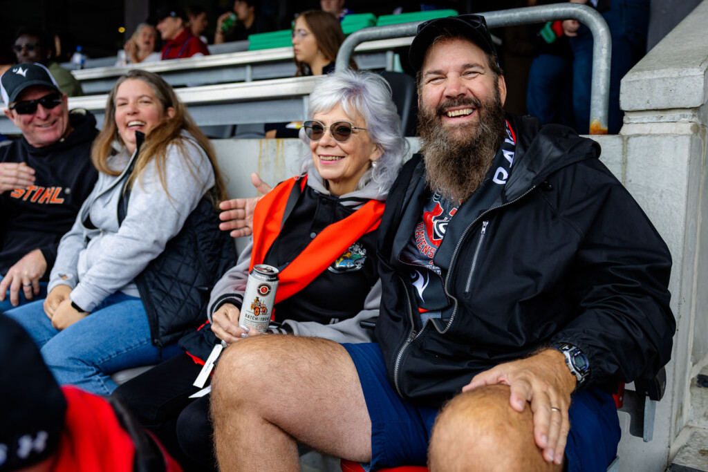Guests smile for a photo at Panda Game
