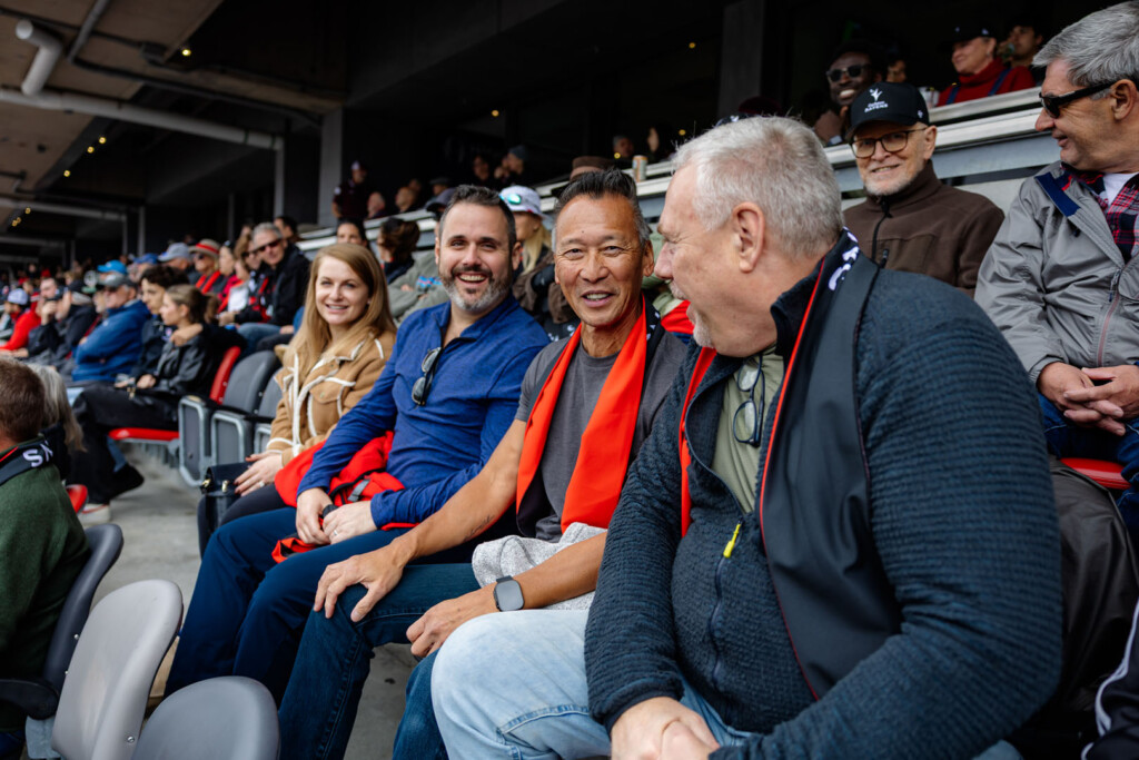 Guests smile for a photo at Panda Game