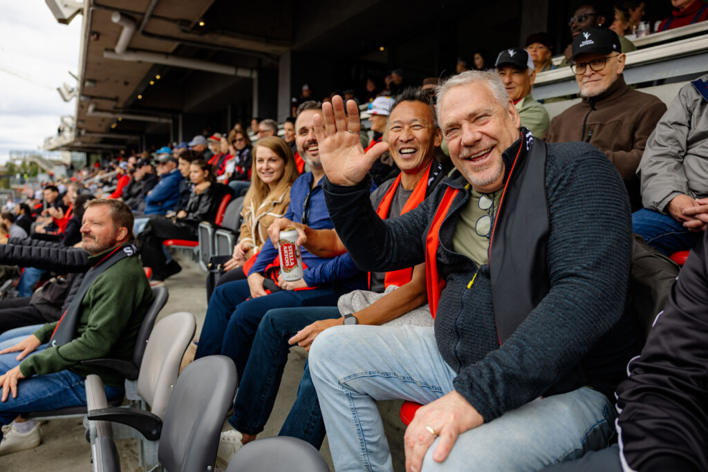 Guests smile for a photo at Panda Game