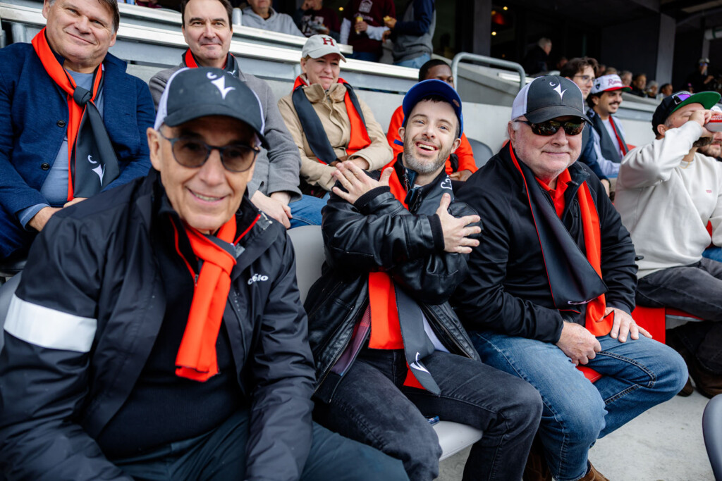 Guests smile for a photo at Panda Game