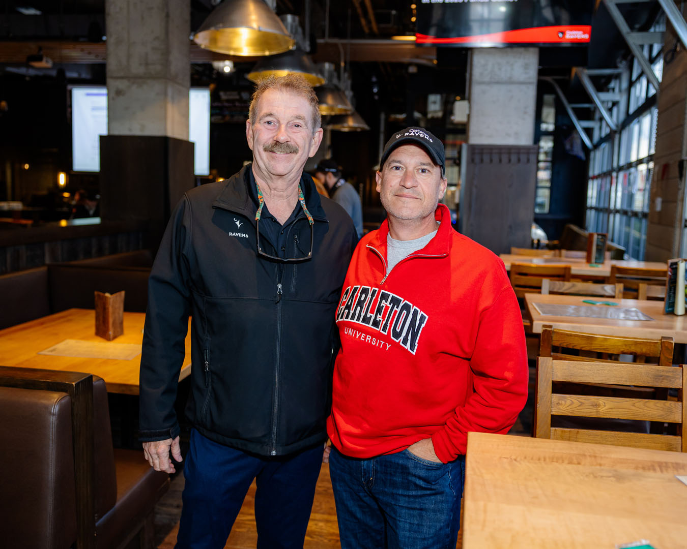 Two guests smile at the Pancaker Breakfast