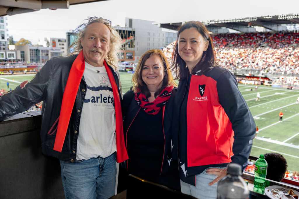 Guests smile for a photo at Panda Game