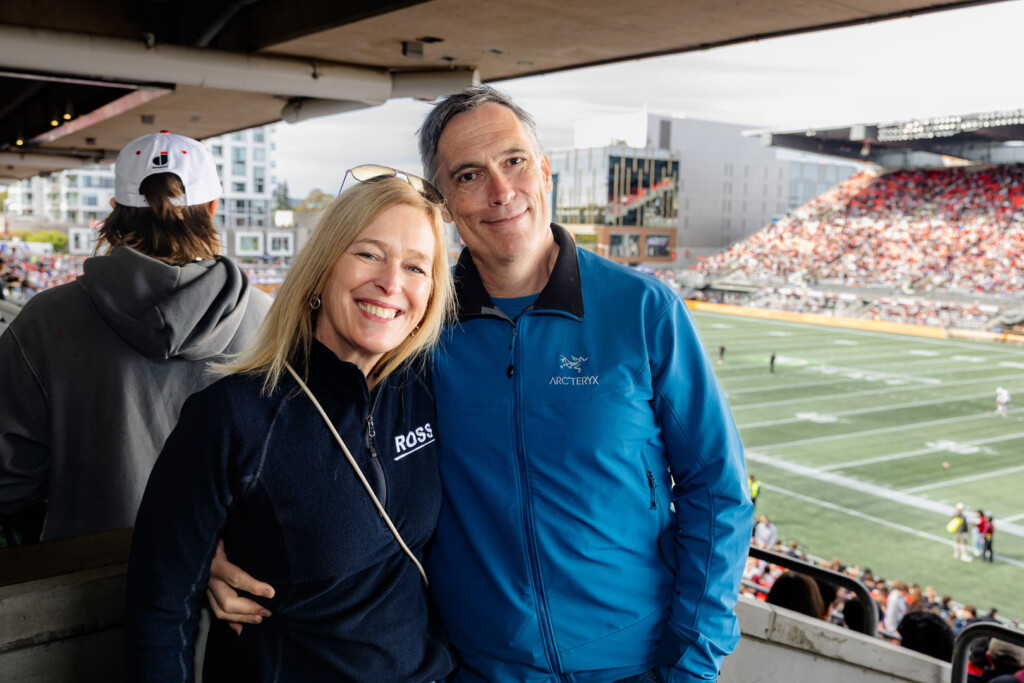 Guests smile for a photo at Panda Game