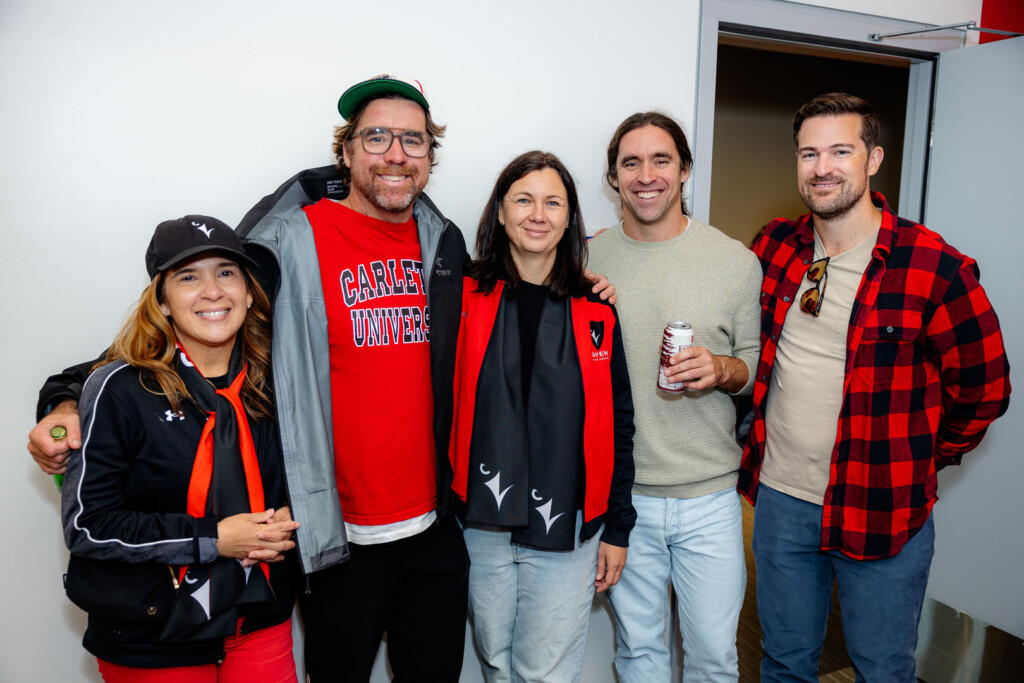 Guests smile for a photo at Panda Game