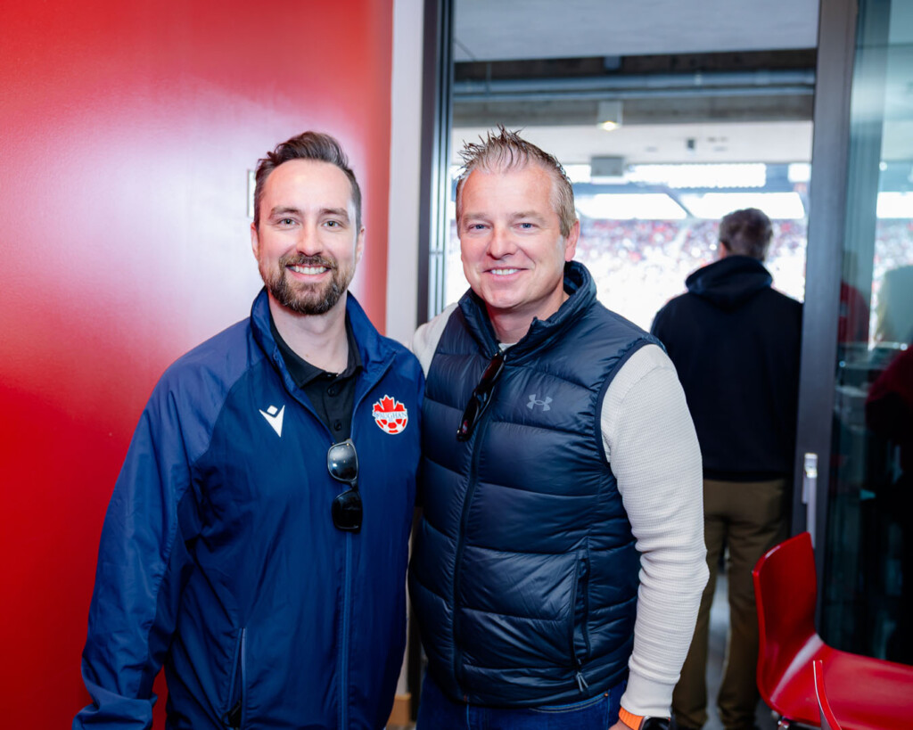 Guests smile for a photo at Panda Game