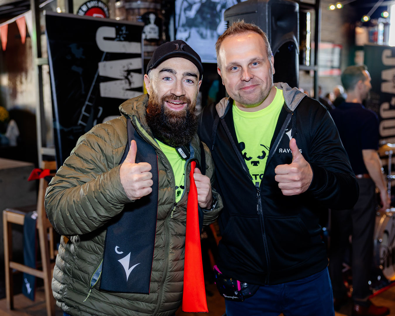 Two people smiling, with thumbs up, at the Pancaker Breakfast.