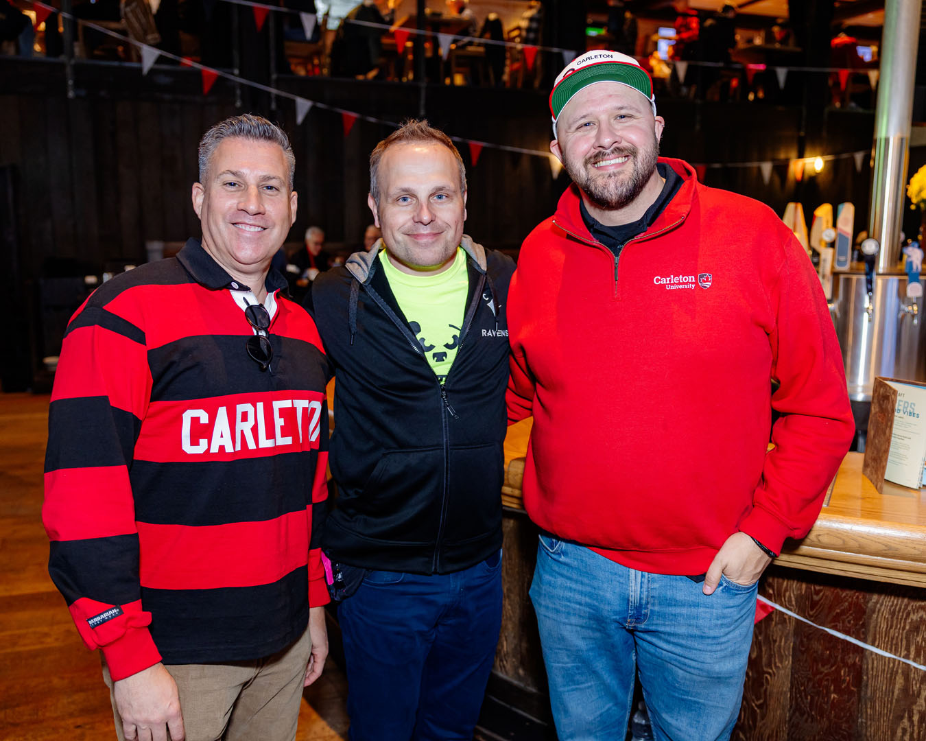 Three people stand smiling at the Pancaker Breakfast