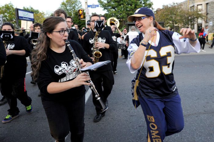 Homecoming attendees dancing during the parade